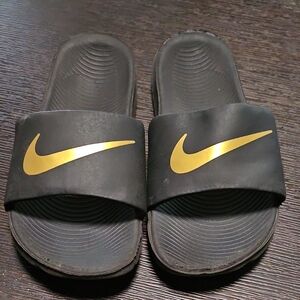 Nike Black Slides with Gold Swoosh
